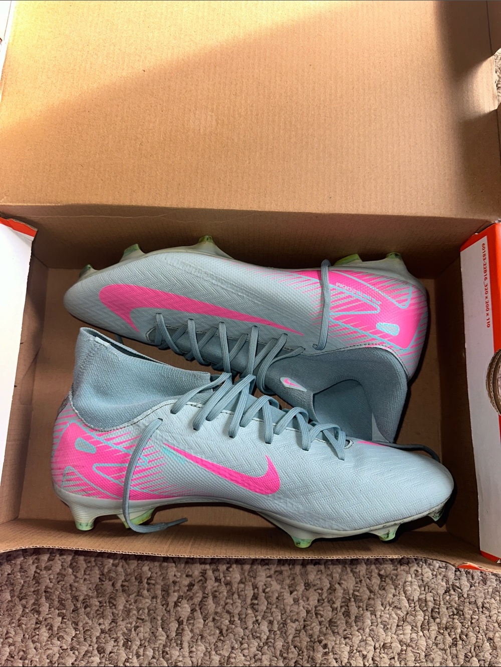 Nike Men’s Light Blue Soccer Cleats with Pink Swoosh